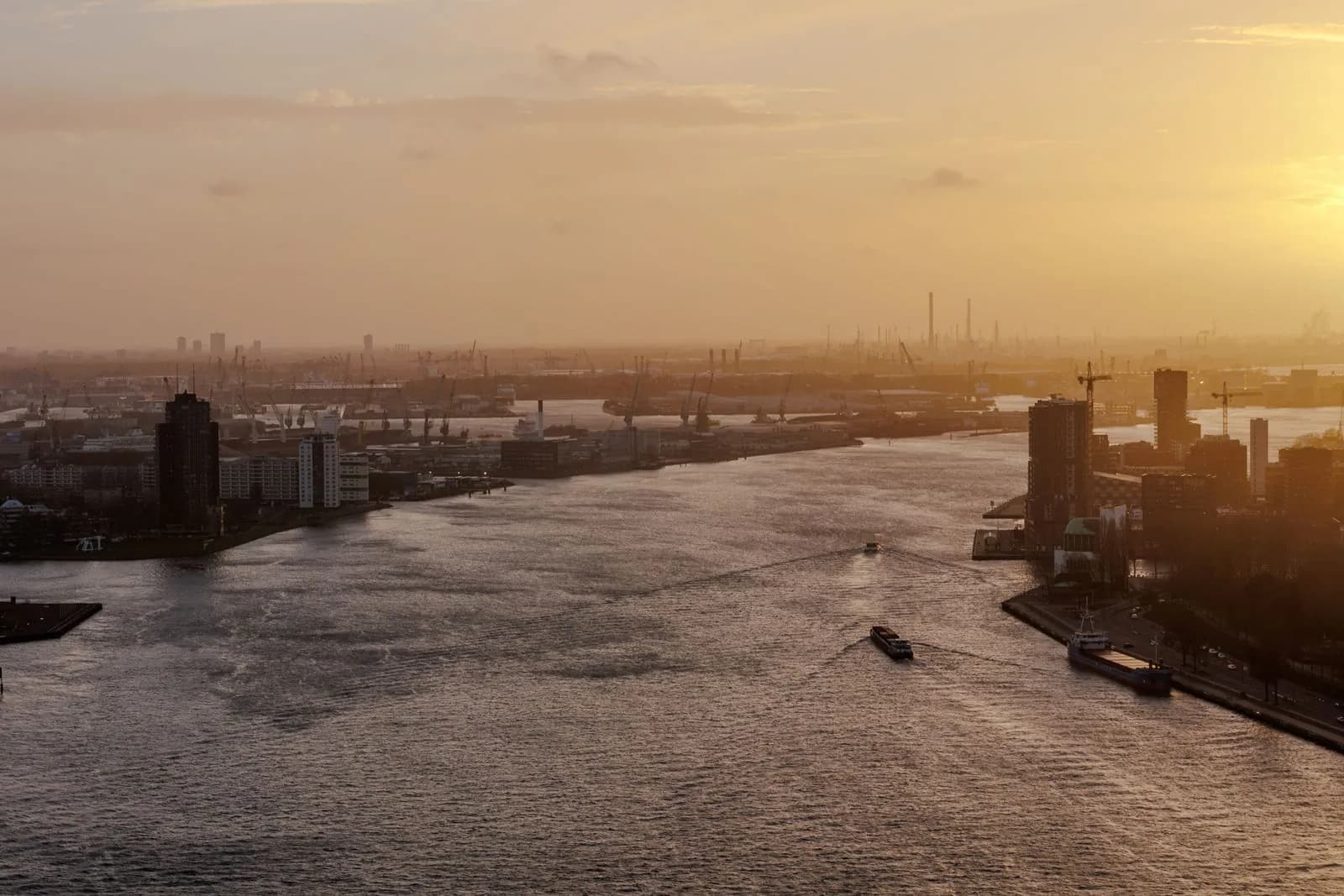 Rotterdam river and port at sunset